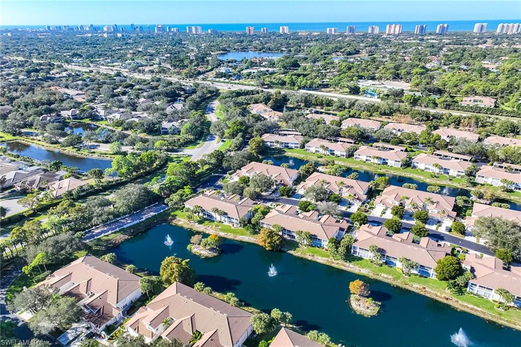 6834 Lantana Bridge Road, Unit 101 Naples, FL 34109 - Photo 49 of 50 an aerial view of a city with lots of residential buildings