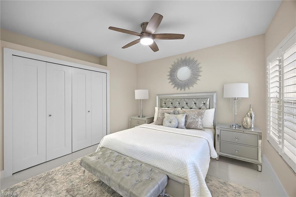 6834 Lantana Bridge Road, Unit 101 Naples, FL 34109 - Photo 5 of 50 a bedroom with a bed and window