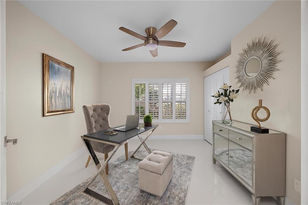 6834 Lantana Bridge Road, Unit 101 Naples, FL 34109 - Photo 6 of 50 a living room with furniture and a window