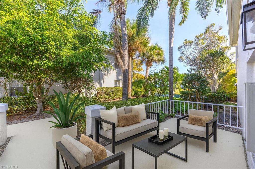 6834 Lantana Bridge Road, Unit 101 Naples, FL 34109 - Photo 9 of 50 a view of a roof deck with couches and potted plants