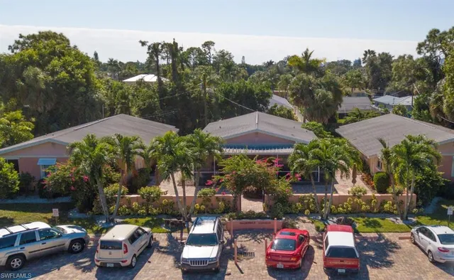 a view of multiple houses with outdoor space
