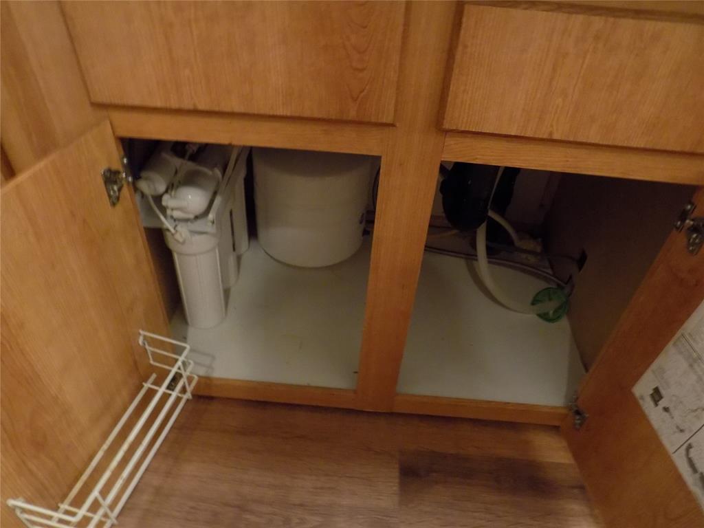 12792 Highway 199 Poolville, TX 76487 - Photo 16 of 24 Water treatment system under sink