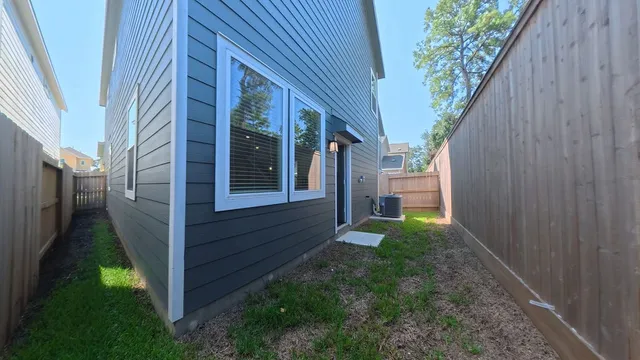 a view of house with backyard