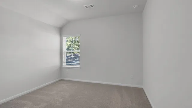 a view of room with hardwood floor and window