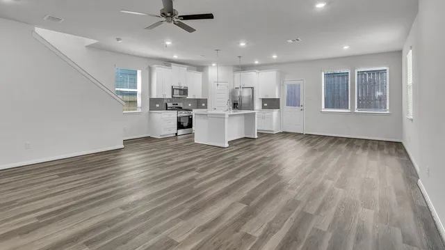a view of kitchen and windows