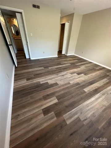 a white toilet sitting next to a sink