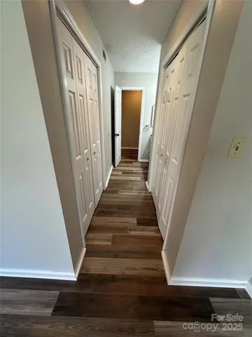 a view of an entryway with wooden floor