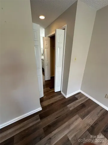 a bathroom with a sink mirror vanity and toilet