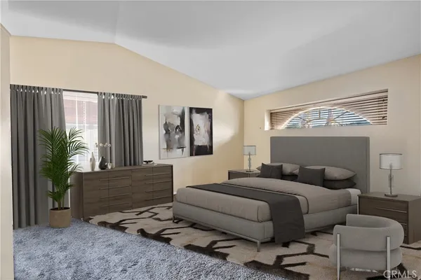 a bedroom with furniture and a potted plant