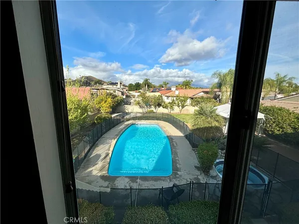 a view of swimming pool from a window