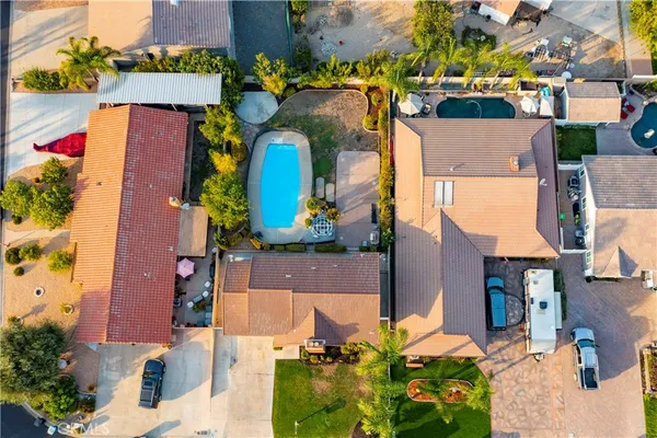 an aerial view of houses with an outdoor space