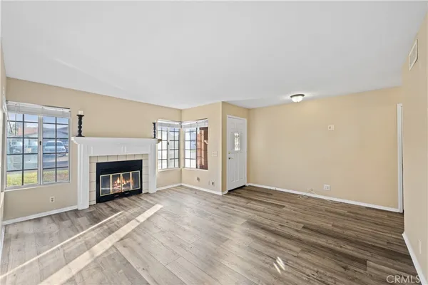 a view of an empty room with a fireplace