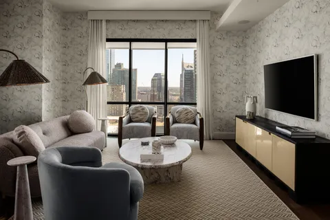 a living room with furniture and a flat screen tv