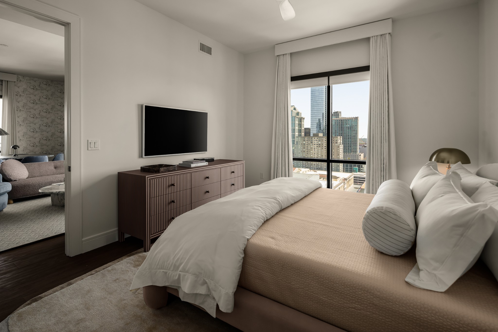 930 Commerce Street, Unit 2 Nashville, TN 37203 - Photo 22 of 57 a bedroom with a bed and a flat tv screen on wall