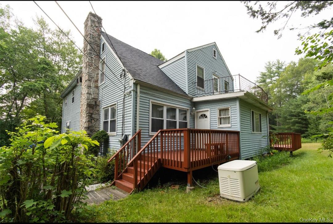 520 Mamakating Road Bloomingburg, NY 12721 - Photo 1 of 1 Back of property featuring a deck and a lawn