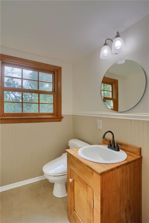 836 Harmony Road Pittsburgh, PA 15237 - Photo 36 of 46 a bathroom with a toilet a sink and mirror