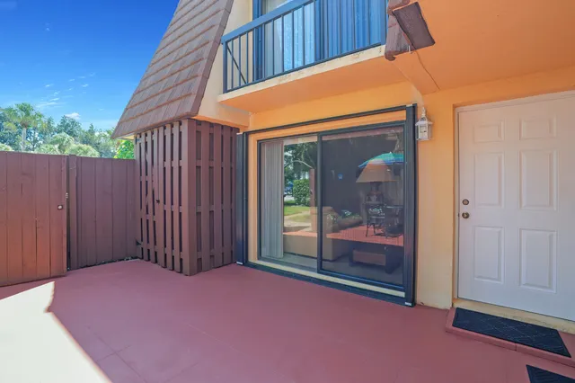 an aerial view of multiple houses with yard