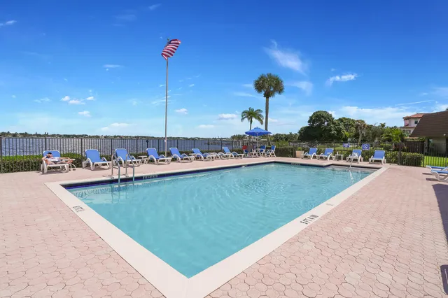 a view of a lake with outdoor seating