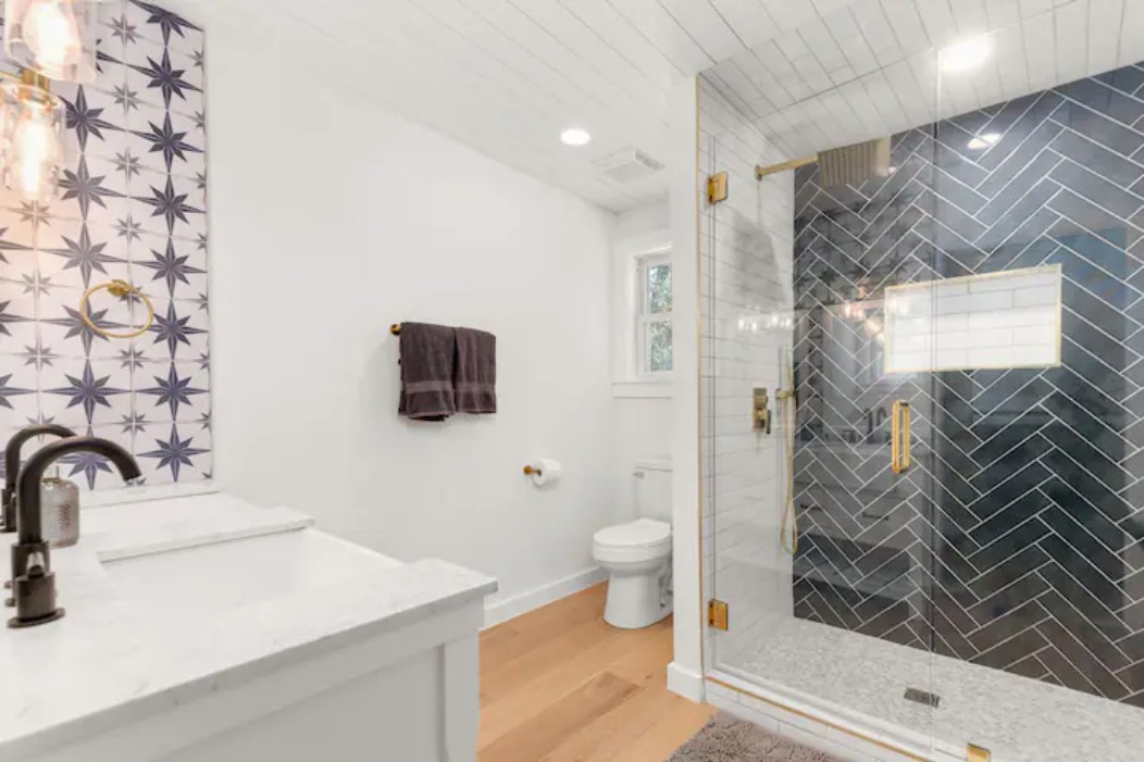 2319 Santa Rita Street Austin, TX 78702 - Photo 11 of 26 Bathroom featuring vanity, a stall shower, light wood-type flooring, and recessed lighting