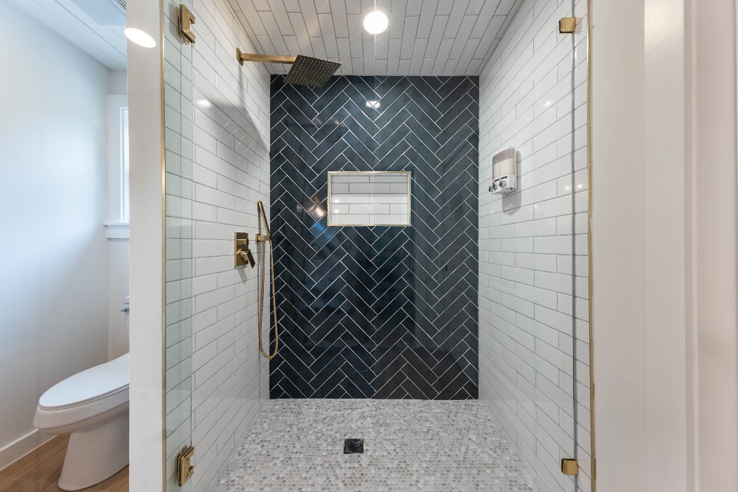 2319 Santa Rita Street Austin, TX 78702 - Photo 13 of 26 Bathroom featuring toilet and a stall shower