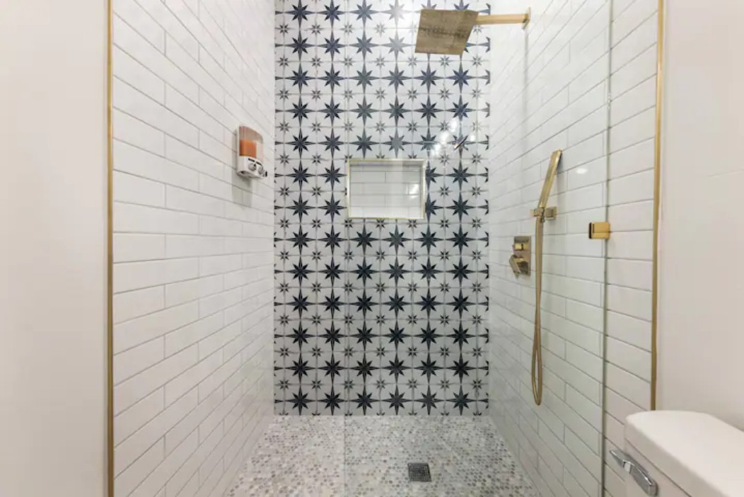 2319 Santa Rita Street Austin, TX 78702 - Photo 17 of 26 Bathroom featuring toilet and tiled shower