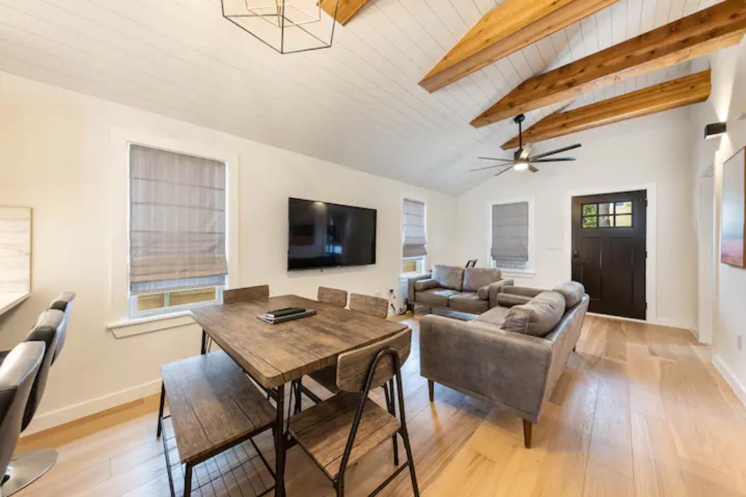 2319 Santa Rita Street Austin, TX 78702 - Photo 3 of 26 Living area featuring light wood finished floors, a wooden ceiling with exposed beams, and ceiling fan