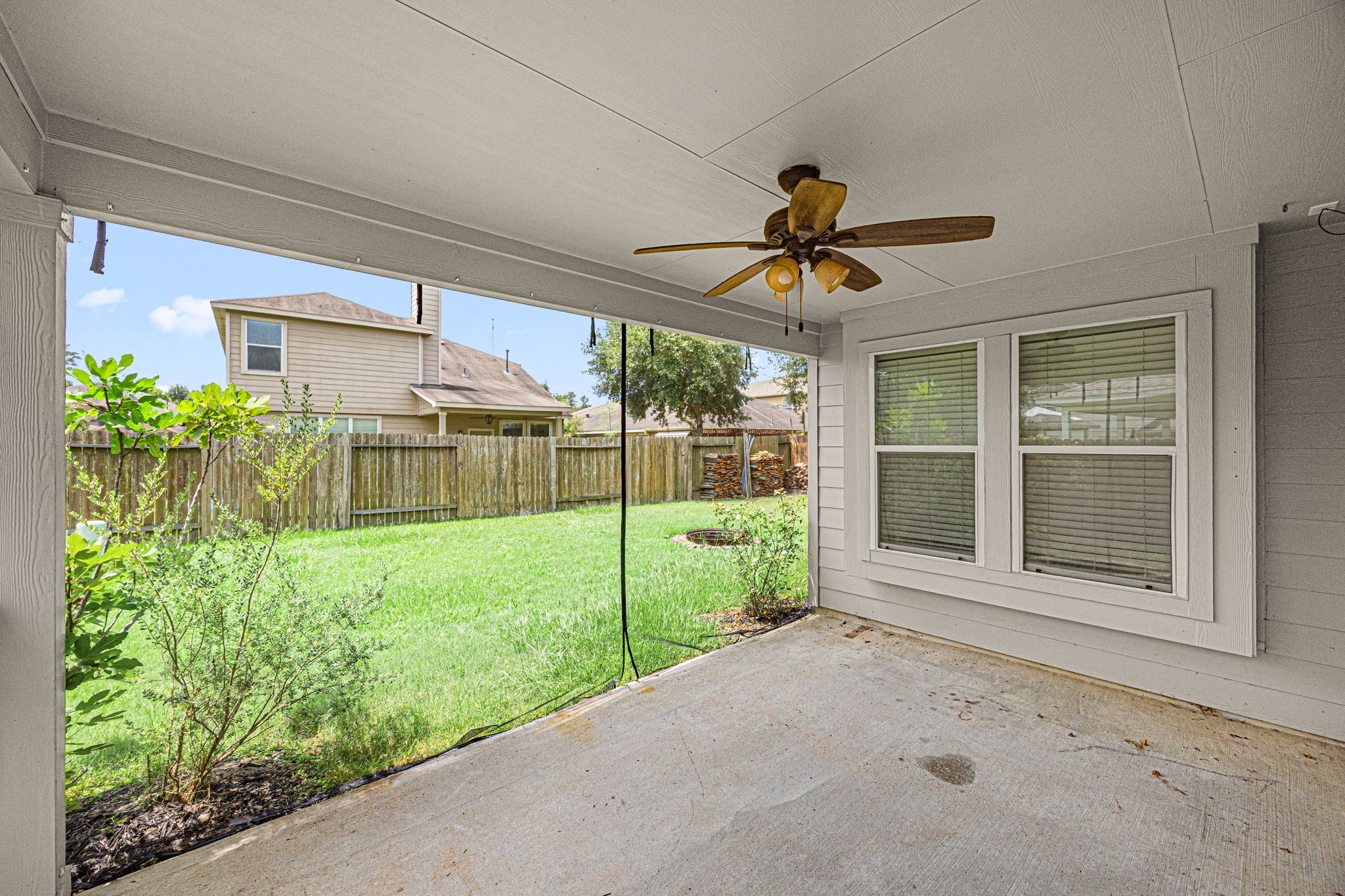 2211 Oak Rise Drive Conroe, TX 77304 - Photo 24 of 29 Covered patio with ceiling fan