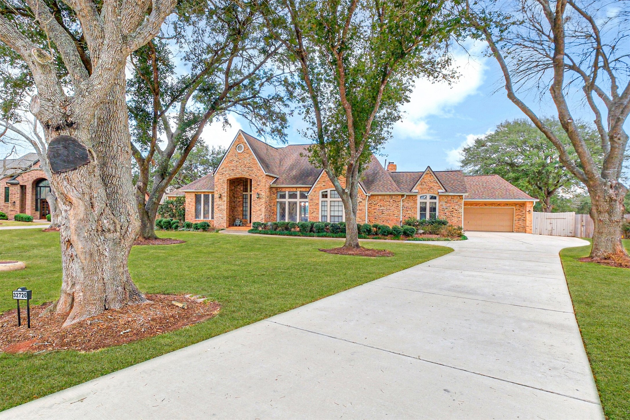 32726 Weybridge Street Fulshear, TX 77441 - Photo 1 of 50 a front view of house with yard and green space