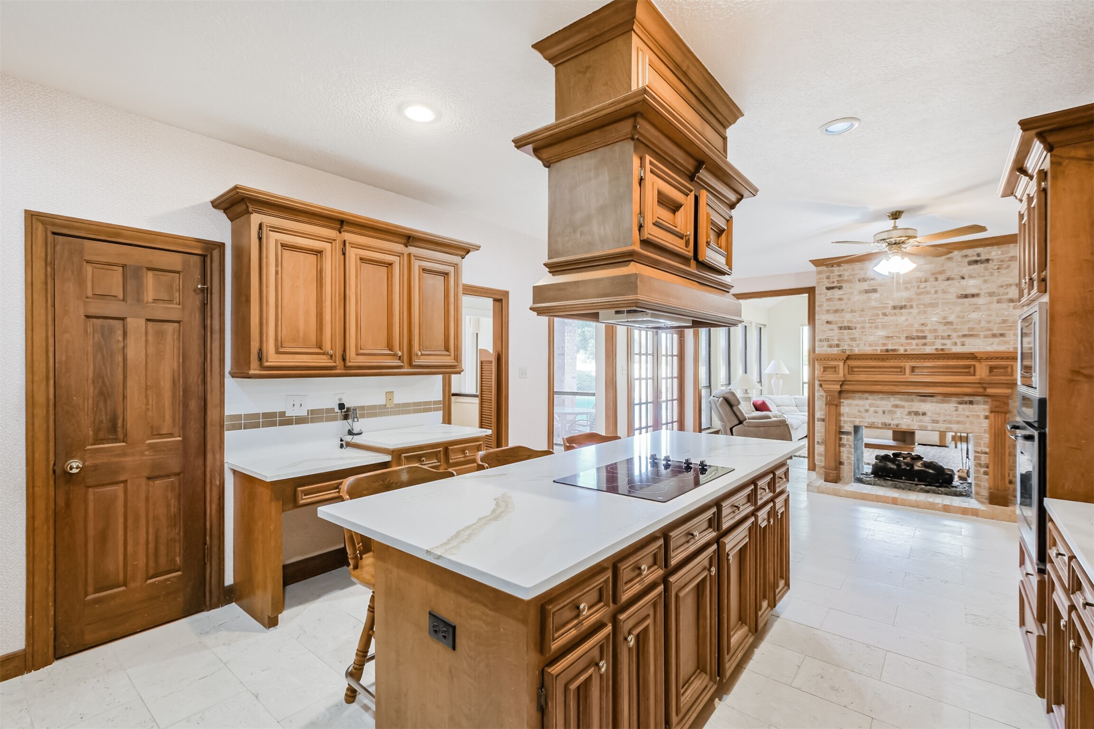 32726 Weybridge Street Fulshear, TX 77441 - Photo 13 of 50 a kitchen that has a lot of cabinets in it