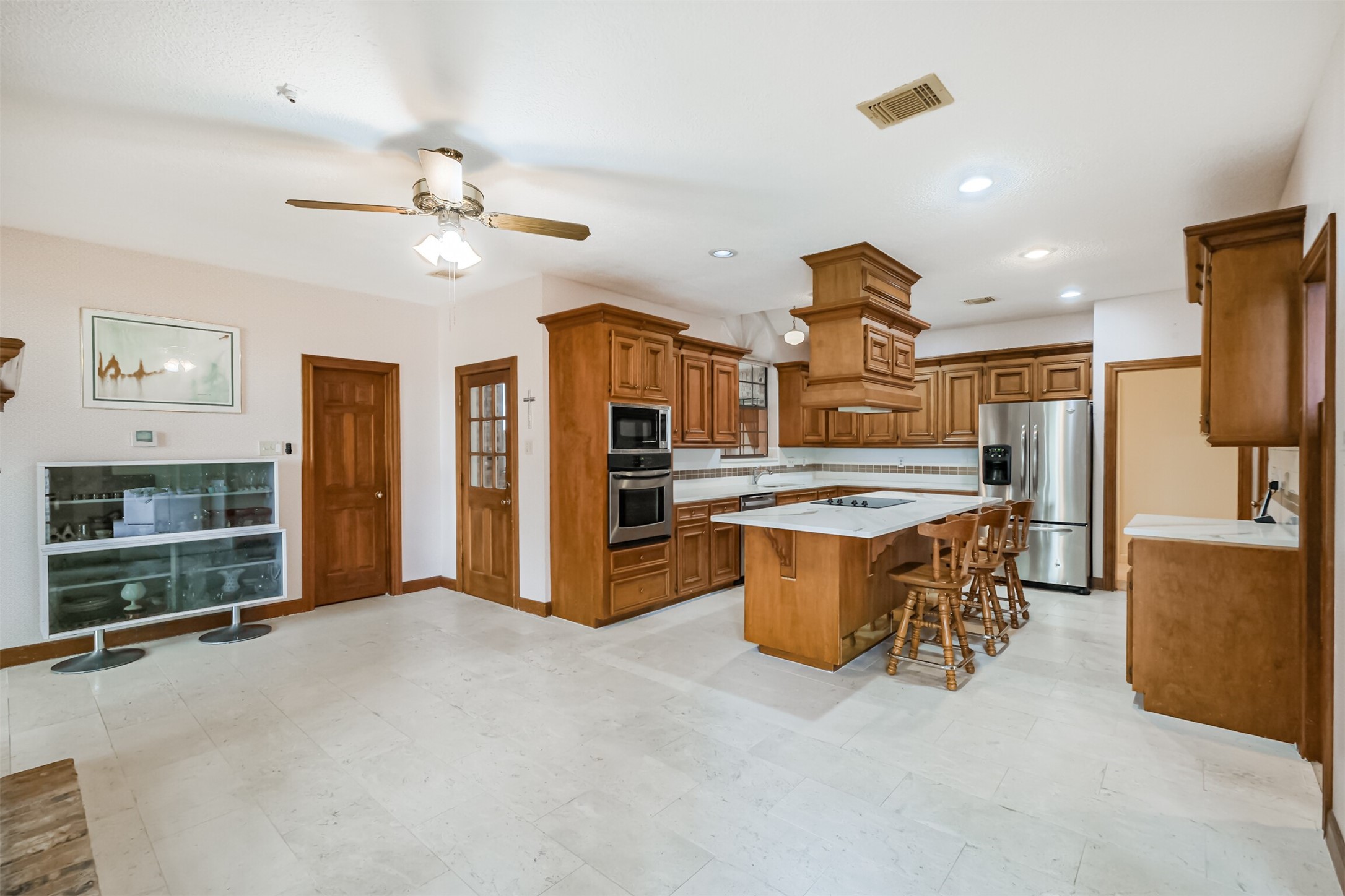 32726 Weybridge Street Fulshear, TX 77441 - Photo 16 of 50 a view of a kitchen with furniture and a kitchen