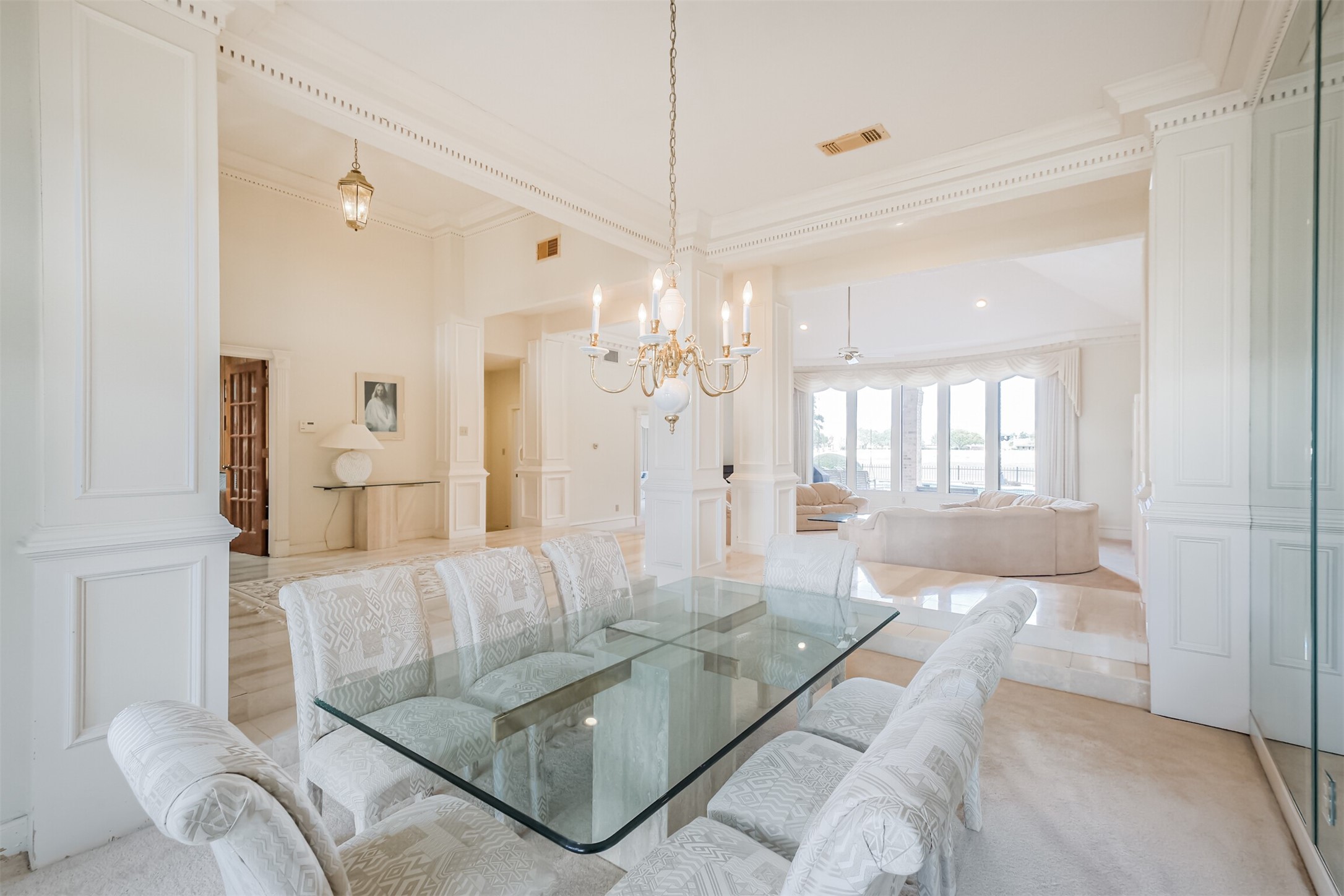 32726 Weybridge Street Fulshear, TX 77441 - Photo 20 of 50 a living room with furniture and a chandelier