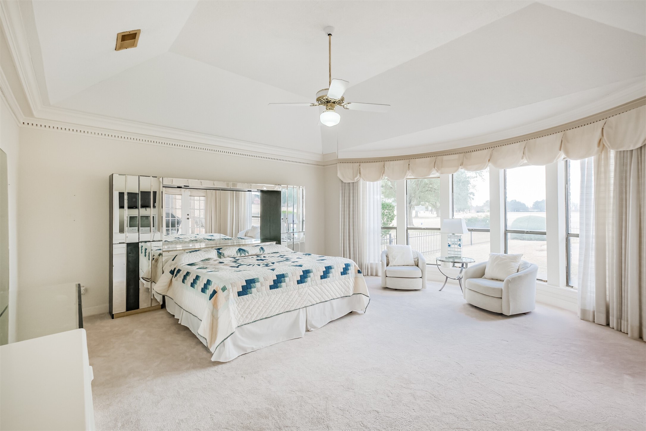 32726 Weybridge Street Fulshear, TX 77441 - Photo 27 of 50 a bedroom with a bed couch and large window