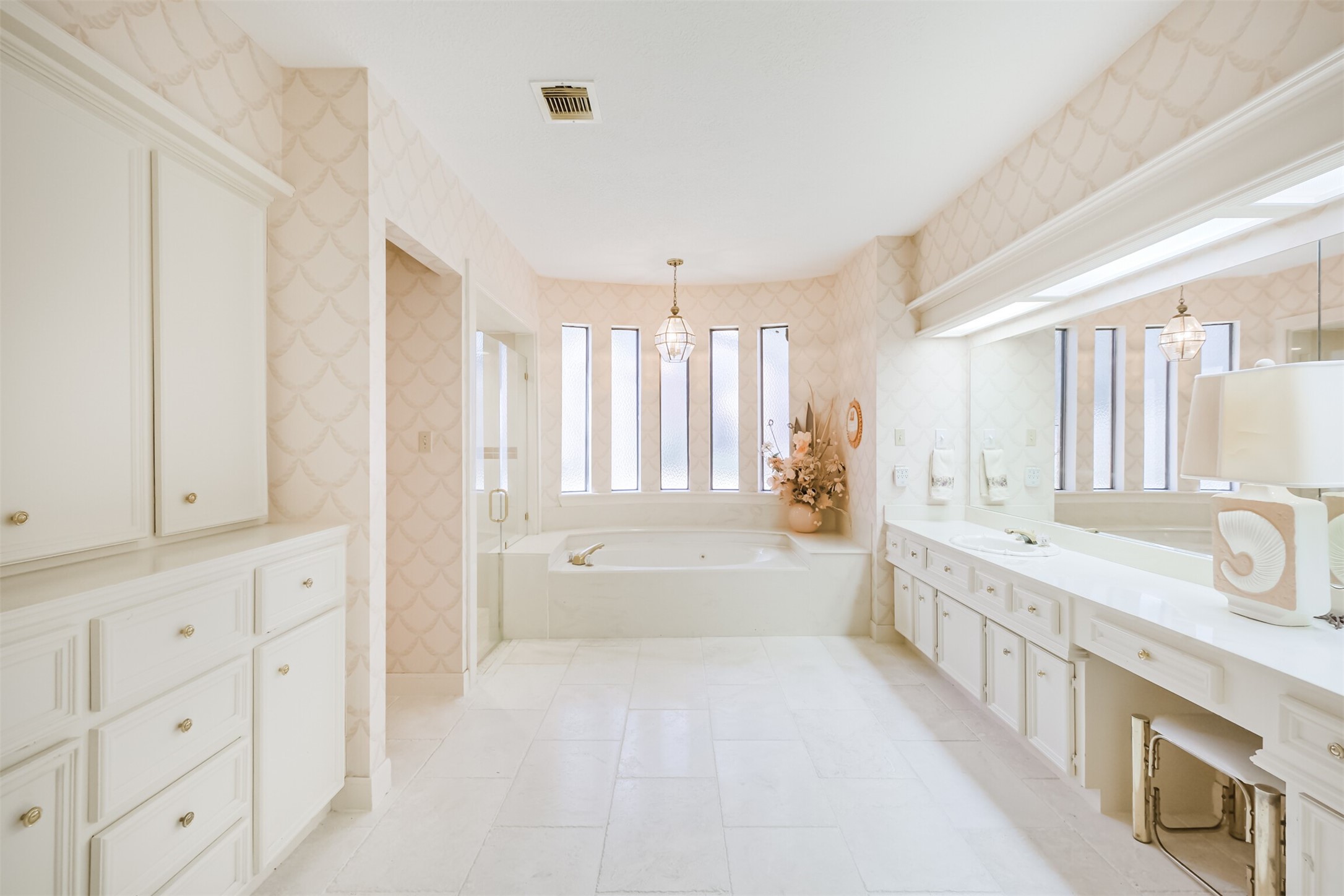 32726 Weybridge Street Fulshear, TX 77441 - Photo 31 of 50 a spacious bathroom with a tub sink and mirror