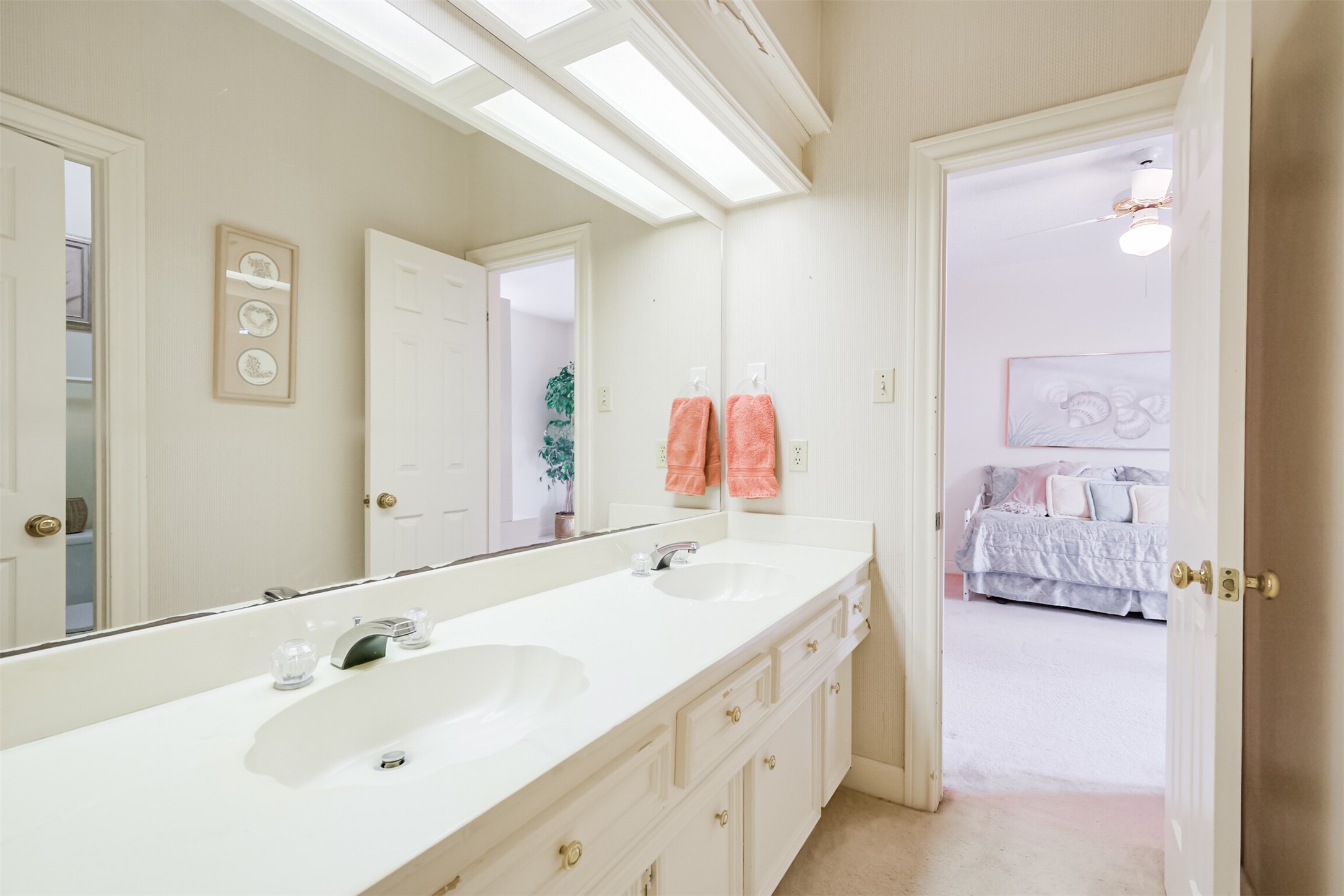 32726 Weybridge Street Fulshear, TX 77441 - Photo 38 of 50 a spacious bathroom with a double vanity sink and a mirror