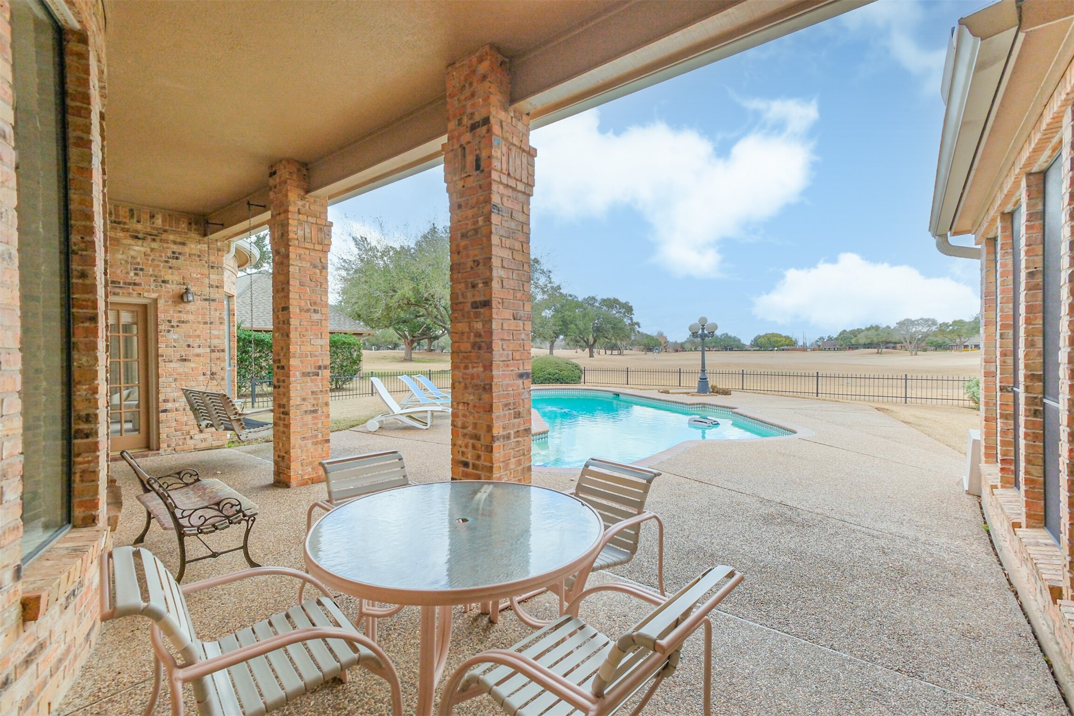 32726 Weybridge Street Fulshear, TX 77441 - Photo 45 of 50 a living room with a floor to ceiling window and floor to ceiling window
