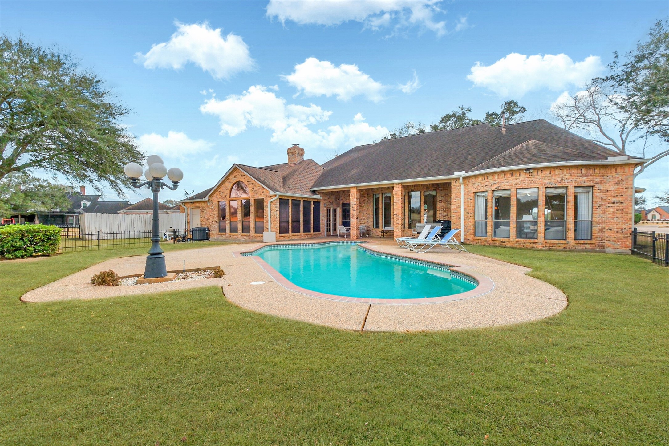 32726 Weybridge Street Fulshear, TX 77441 - Photo 47 of 50 a view of a house with swimming pool and porch