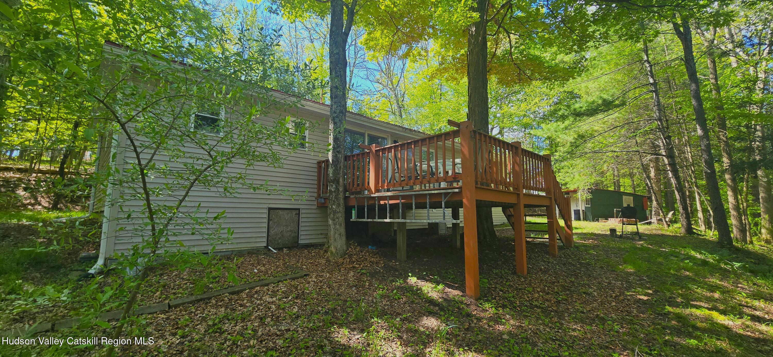 51 Enchanted Valley Road Cornwallville, NY 12418 - Photo 20 of 21 a backyard of a house with table and chairs