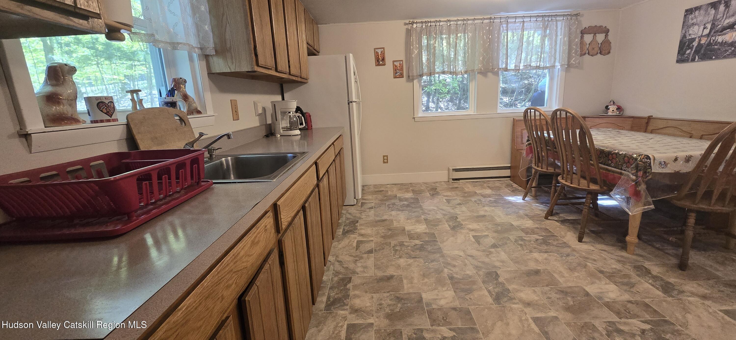 51 Enchanted Valley Road Cornwallville, NY 12418 - Photo 8 of 21 a view of a kitchen with furniture and windows