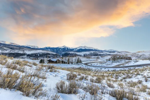 a view of a lake with mountains in the background