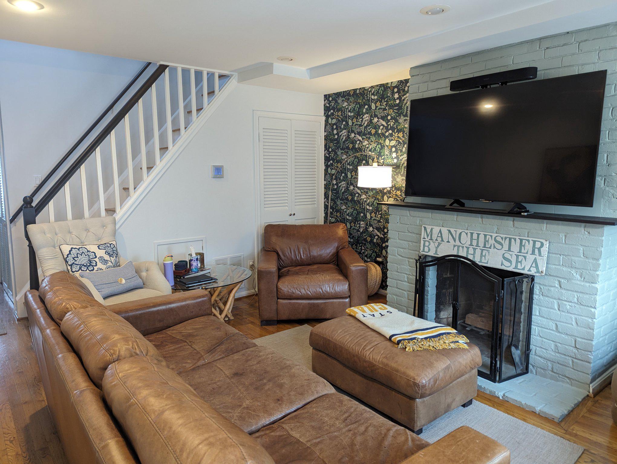 Cozy living space with wood-burning fireplace.