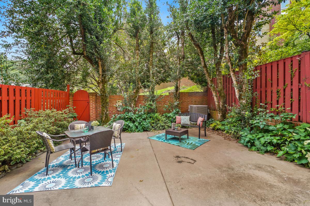 2757 Unicorn Lane Northwest Washington, DC 20015 - Photo 11 of 43 a backyard of a house with a garden and outdoor seating