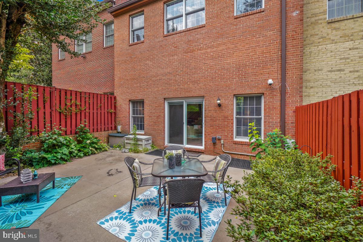 2757 Unicorn Lane Northwest Washington, DC 20015 - Photo 12 of 43 a view of a house with backyard sitting area and garden