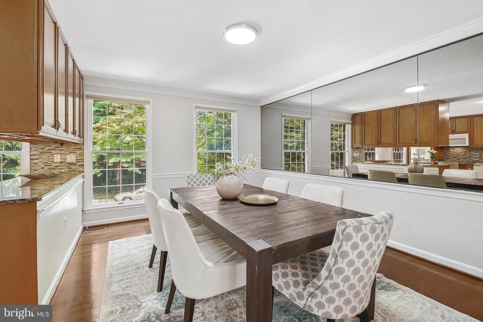 2757 Unicorn Lane Northwest Washington, DC 20015 - Photo 17 of 43 a view of a dining room with furniture window and wooden floor