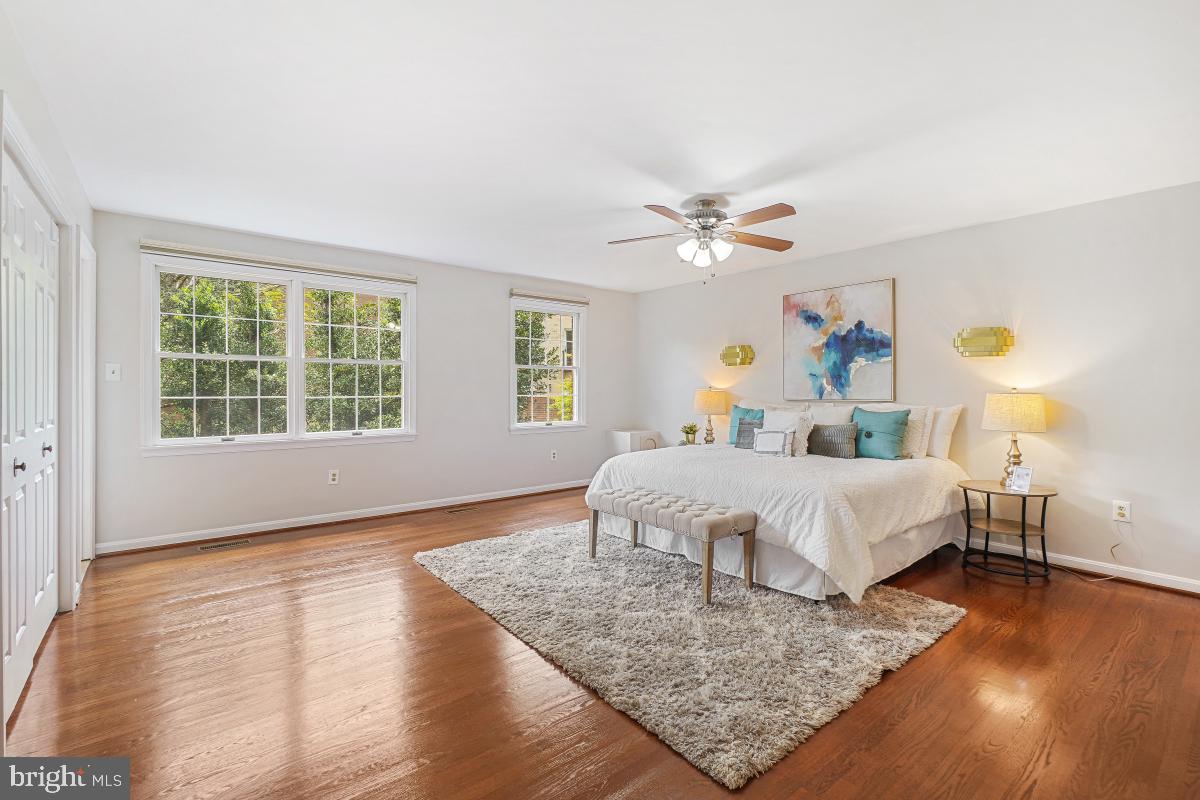 2757 Unicorn Lane Northwest Washington, DC 20015 - Photo 33 of 43 a bedroom with a bed chandelier and a window