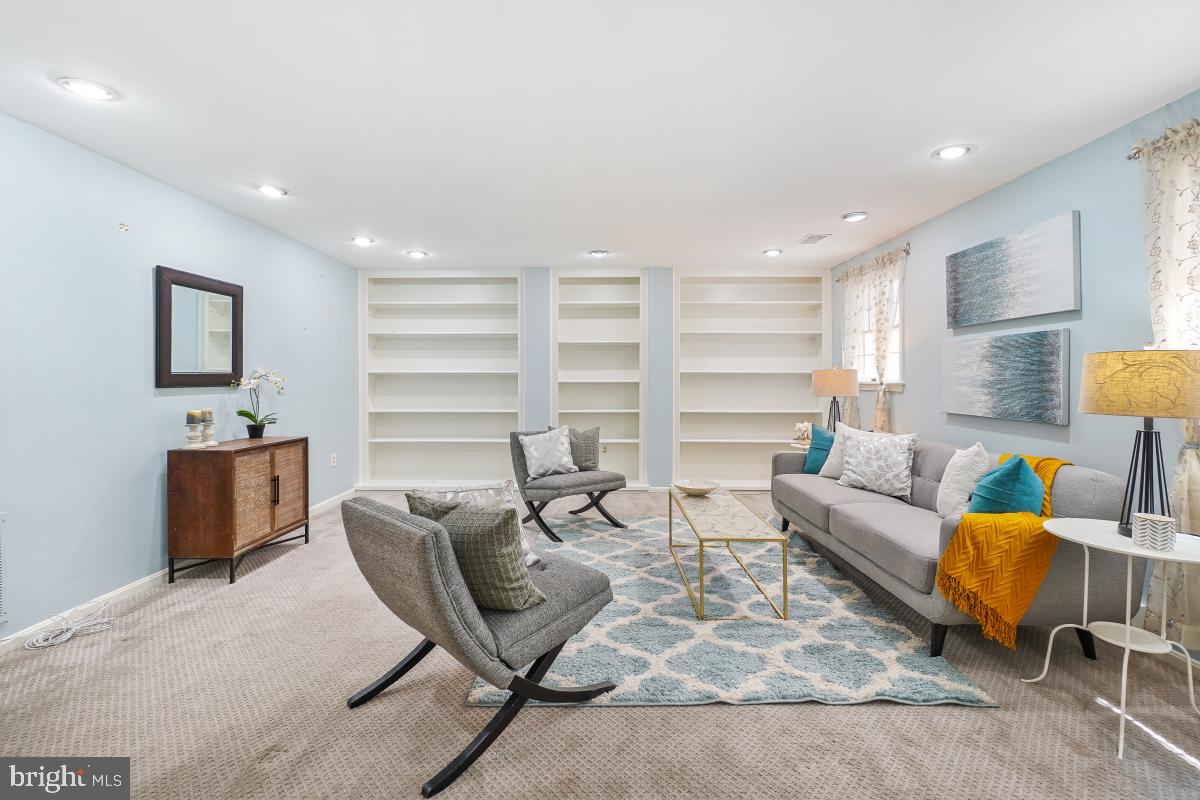 2757 Unicorn Lane Northwest Washington, DC 20015 - Photo 40 of 43 a living room with furniture a lamp and a window