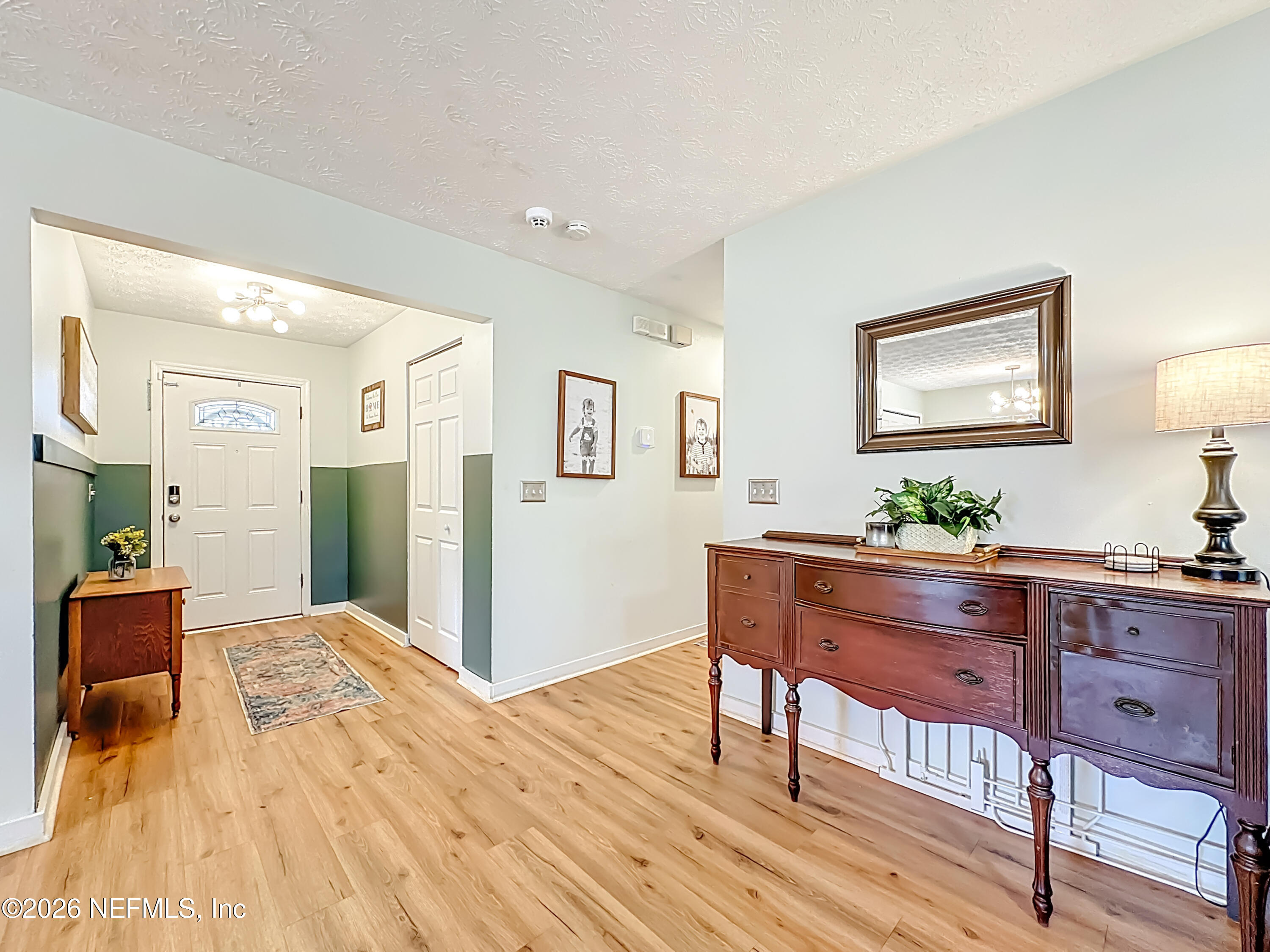 8302 Cassie Road Jacksonville, FL 32221 - Photo 11 of 48 a room with furniture and a wooden floor