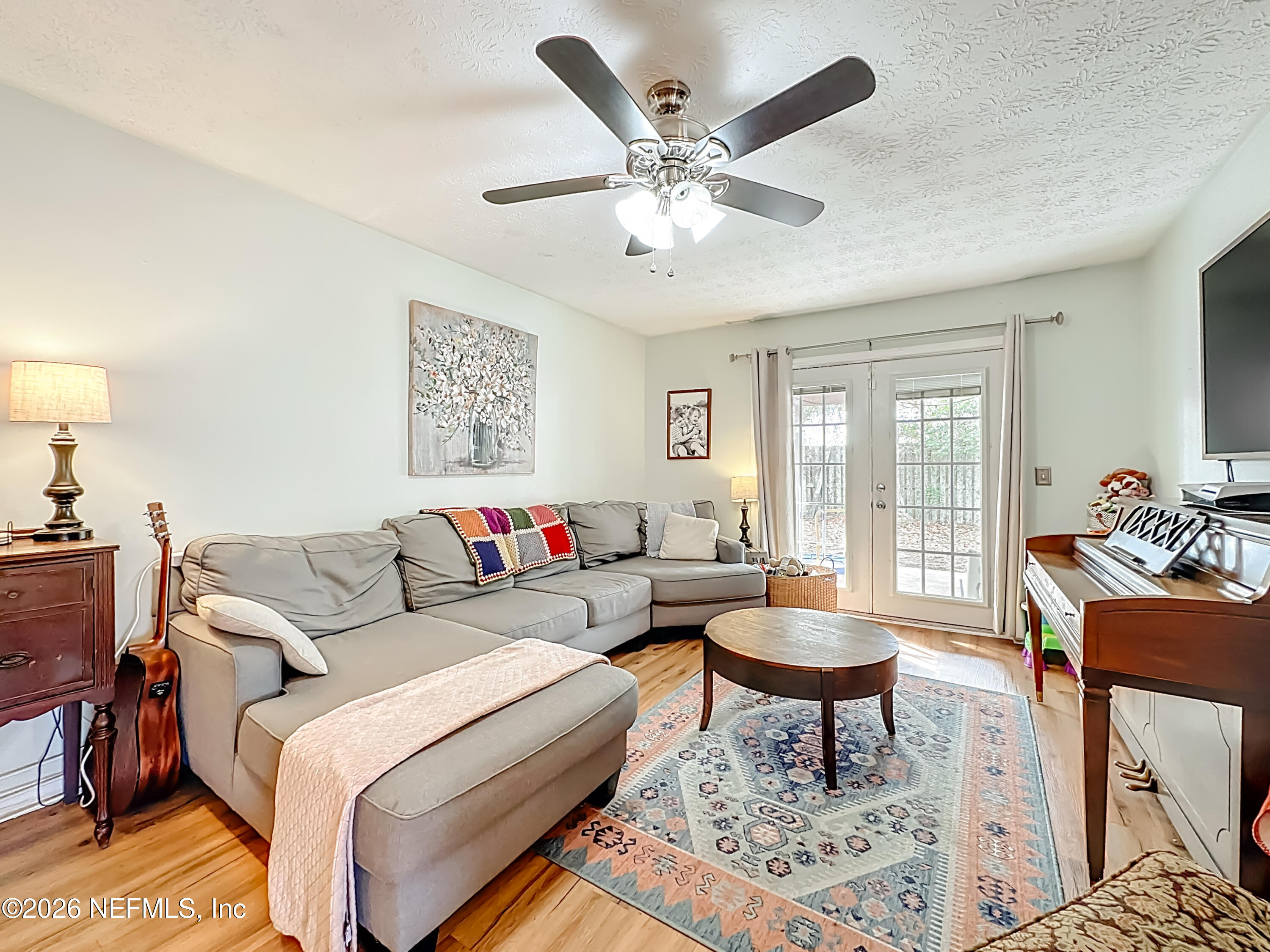 8302 Cassie Road Jacksonville, FL 32221 - Photo 14 of 48 a living room with furniture and a large window