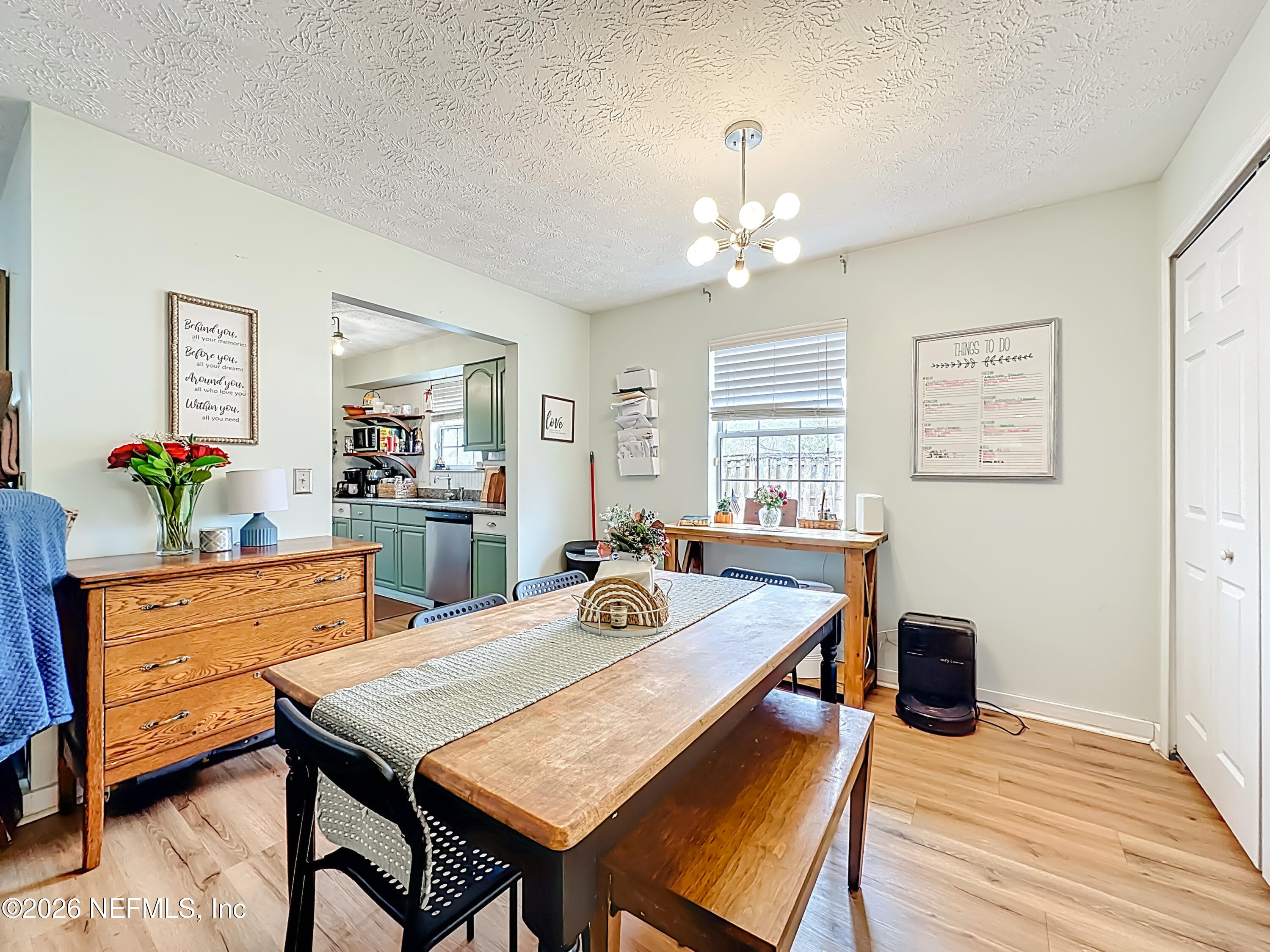 8302 Cassie Road Jacksonville, FL 32221 - Photo 16 of 48 a dining room with furniture and window