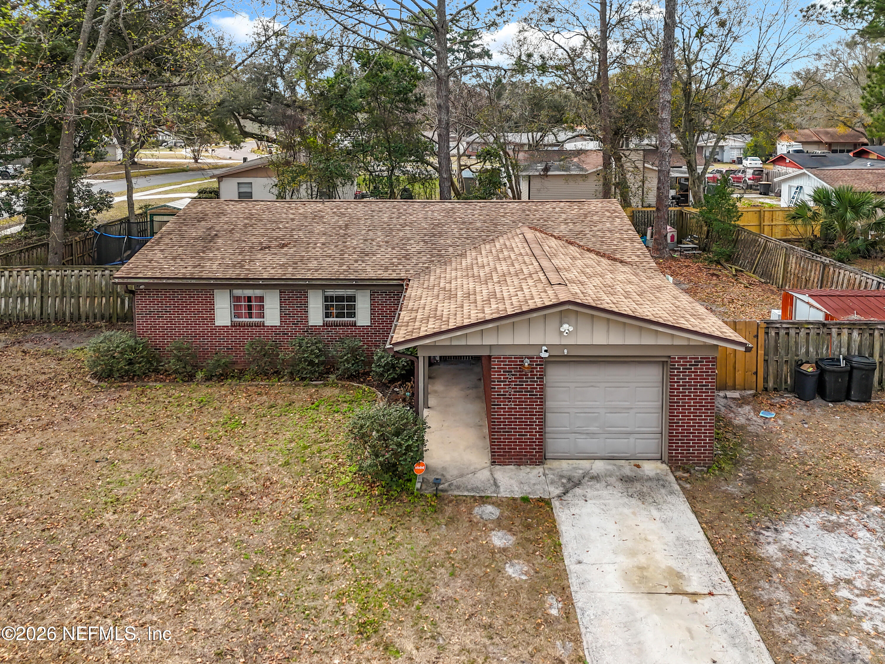 8302 Cassie Road Jacksonville, FL 32221 - Photo 2 of 48 a front view of a house with a yard and garage