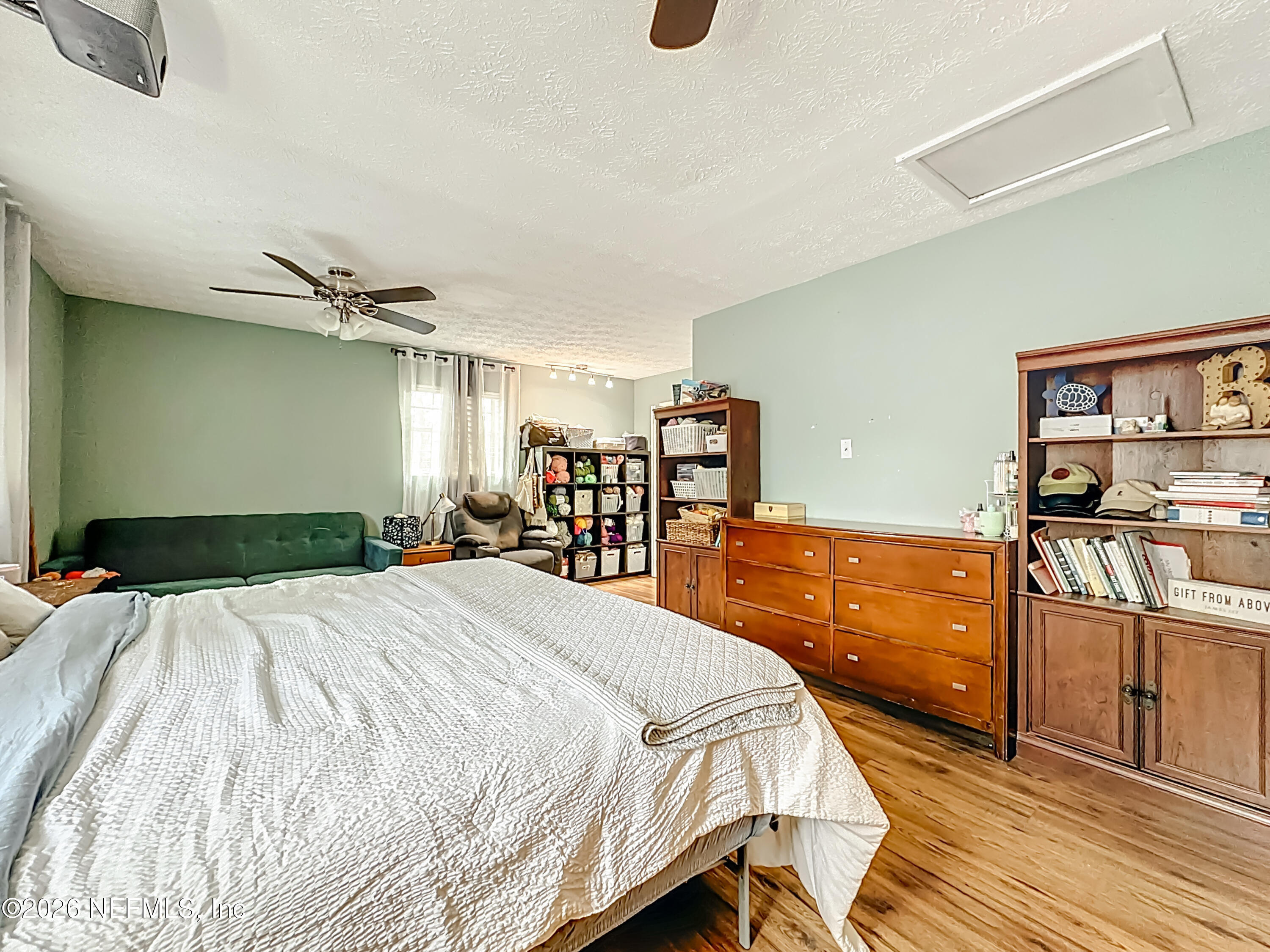 8302 Cassie Road Jacksonville, FL 32221 - Photo 22 of 48 a bed room with a bed and a cabinets